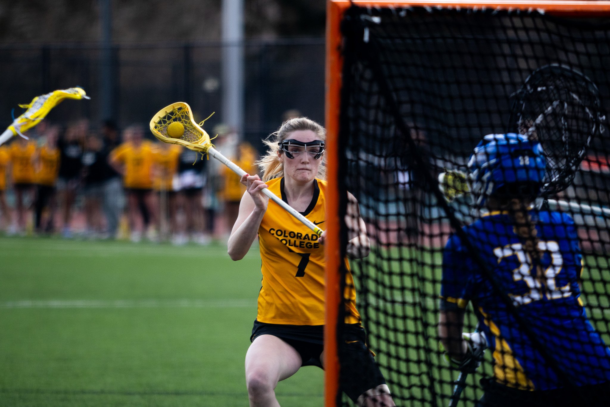 CC women's lacrosse player cradling ball