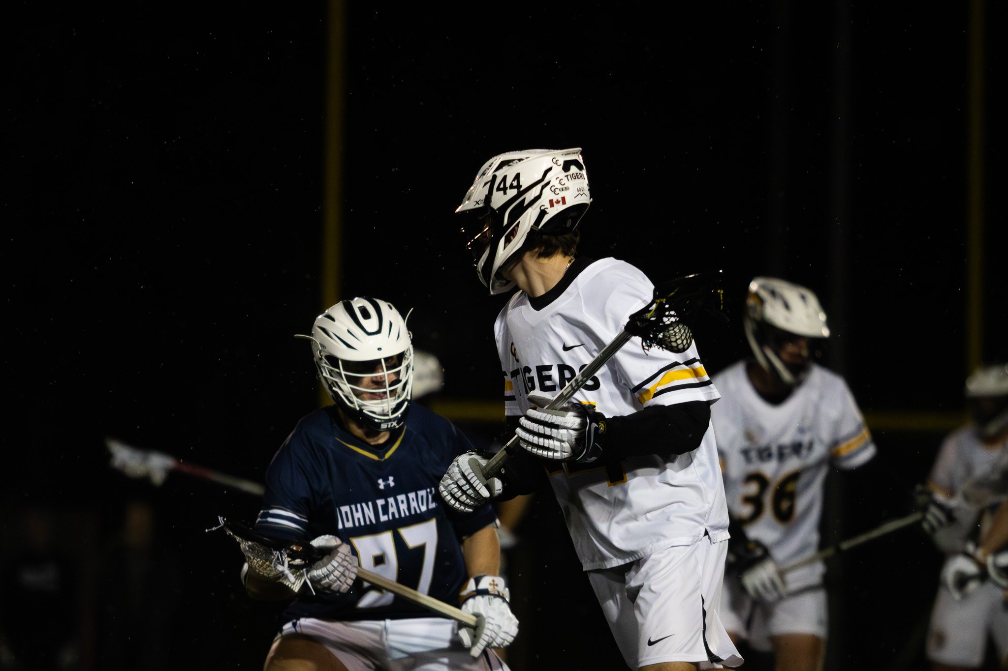 CC men's lacrosse player cradling ball