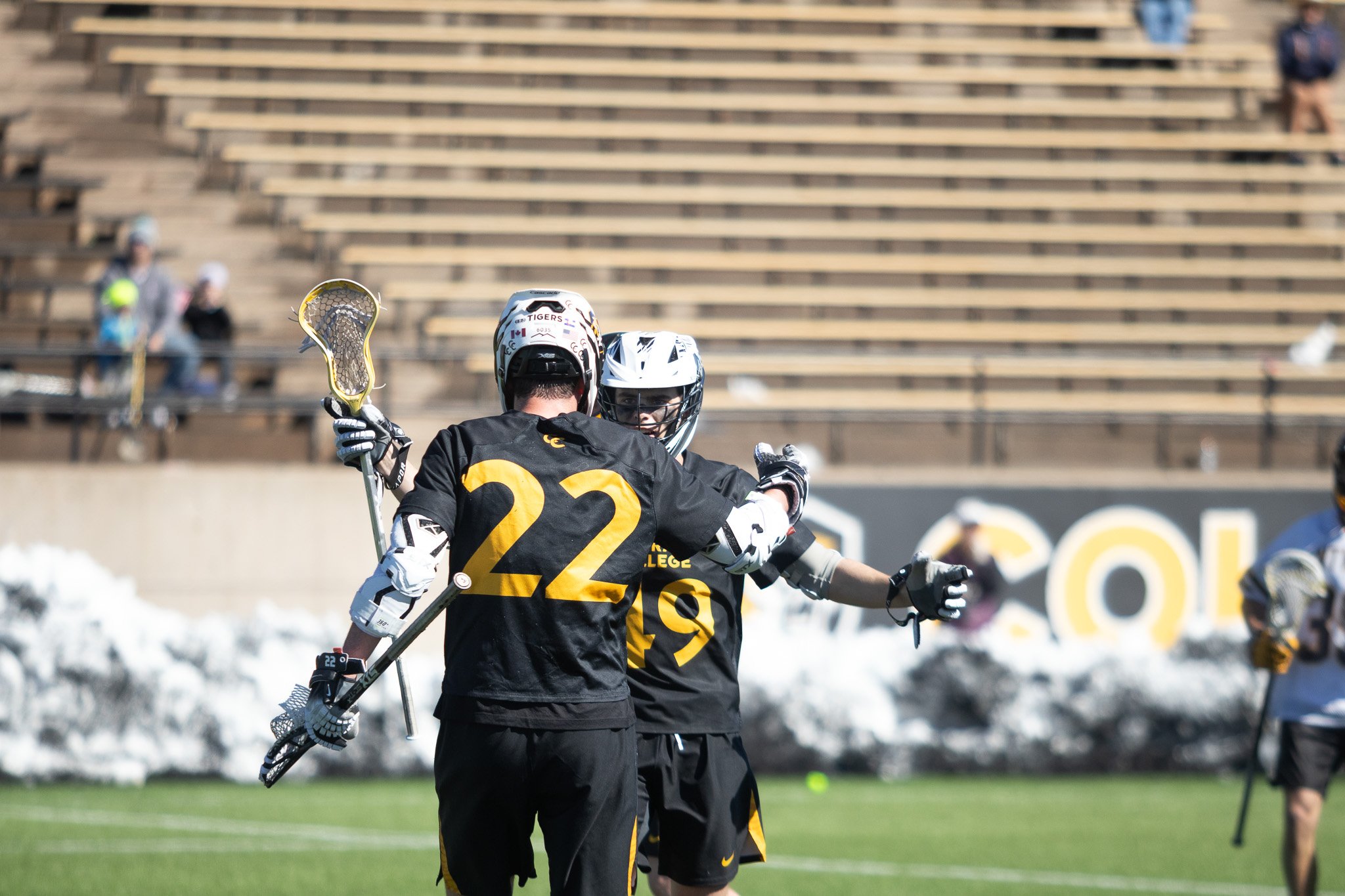 CC men's lacrosse player in full sprint