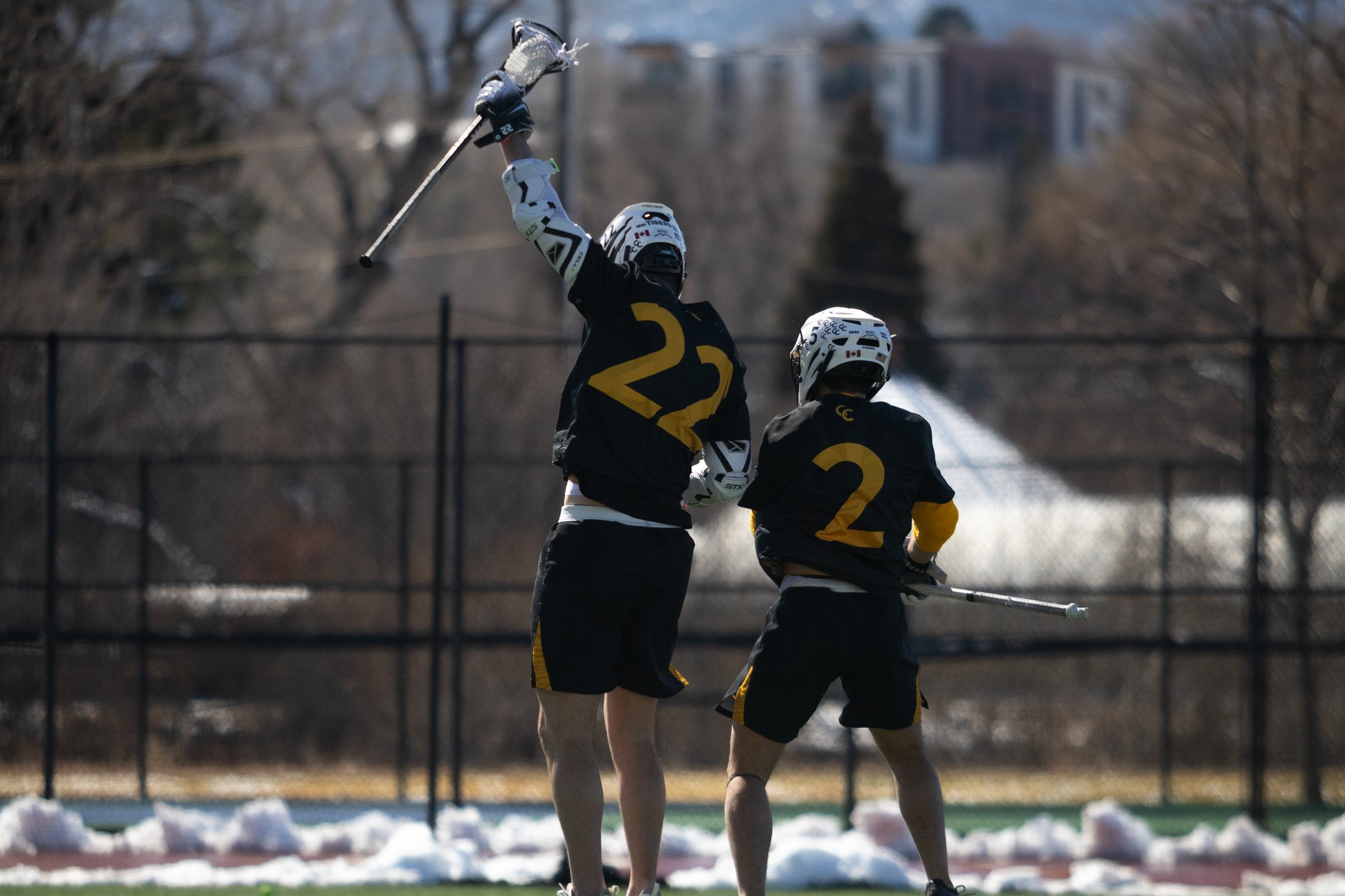 CC men's lacrosse player attacking