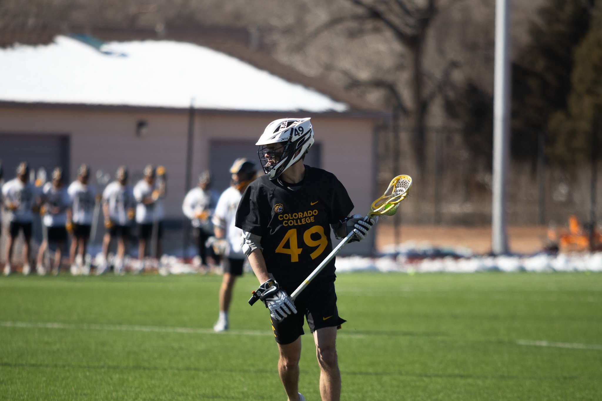 CC men's lacrosse player mid-game
