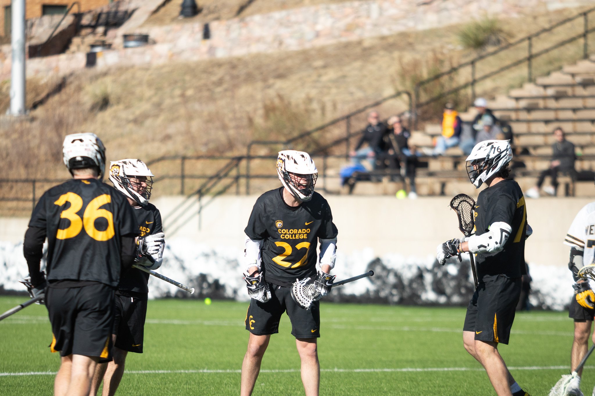 CC men's lacrosse player celebrating